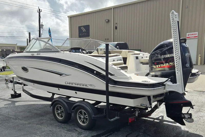 Slide: The Image of 2019 Chaparral 230 Suncoast boat on trailer with Yamaha outboard motor. - 5