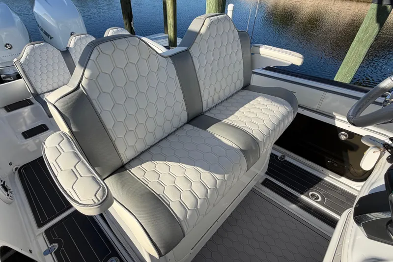 Slide: The Image of 2022 Glasstream 328 Pro-XS boat interior with hexagonal-patterned seating. - 18