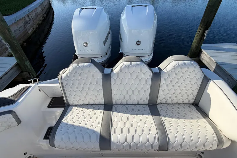 Slide: The Image of 2022 Glasstream 328 Pro-XS boat with dual Mercury engines and hexagonal pattern seating. - 19