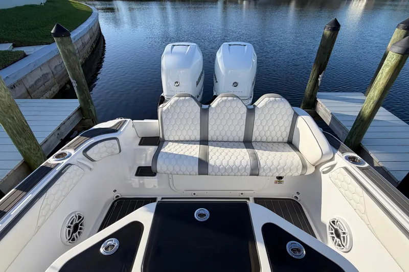 Slide: The Image of 2022 Glasstream 328 Pro-XS boat with dual engines, docked on calm water. - 20