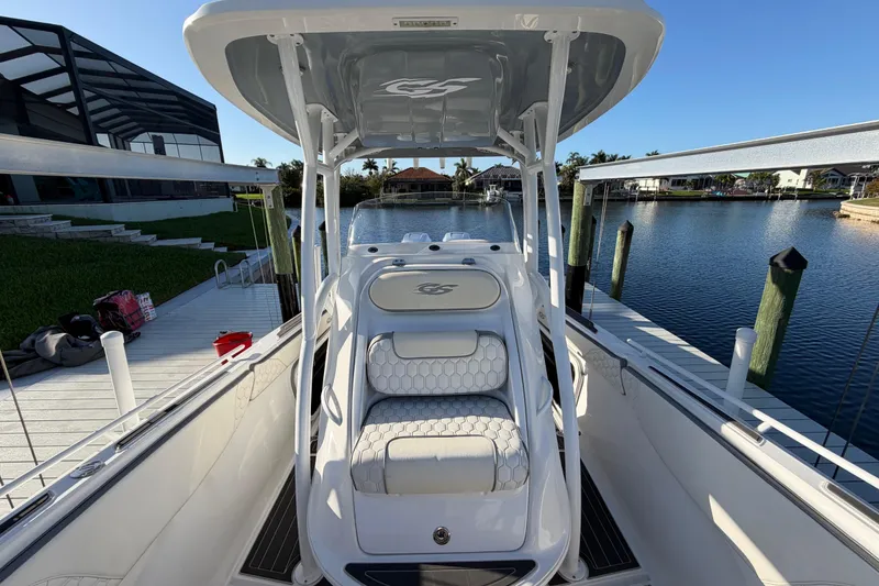 Slide: The Image of 2022 Glasstream 328 Pro-XS boat docked by a serene waterfront. - 22