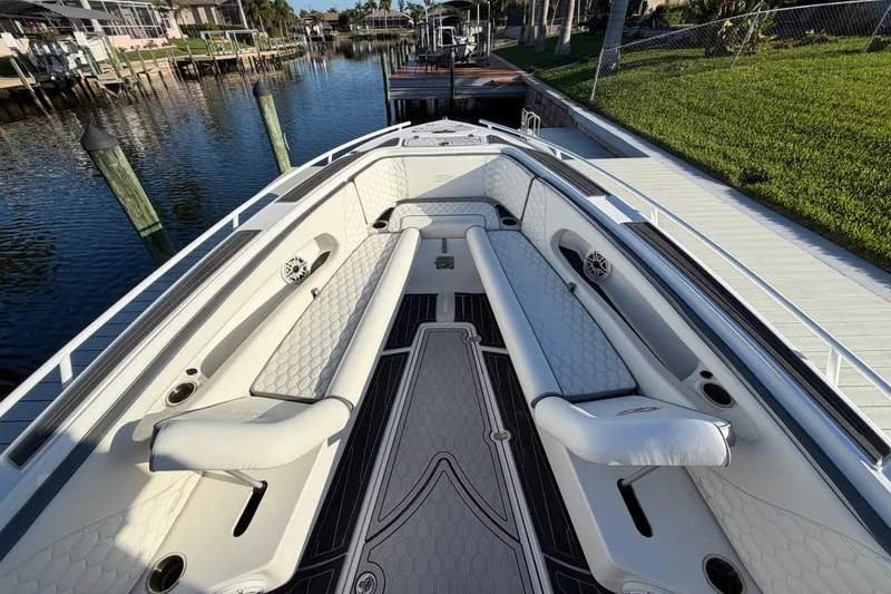 Slide: The Image of 2022 Glasstream 328 Pro-XS boat interior with luxurious seating and waterfront view. - 23