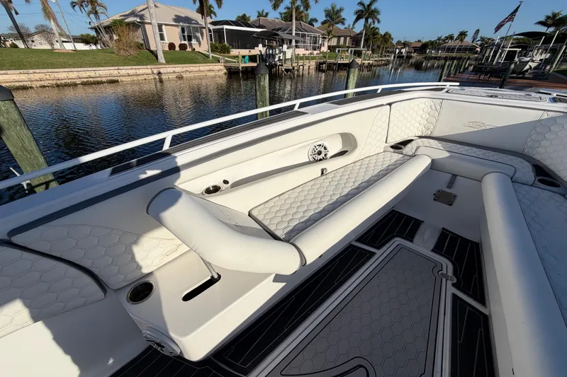 Slide: The Image of 2022 Glasstream 328 Pro-XS boat interior with white seating and waterfront view. - 25