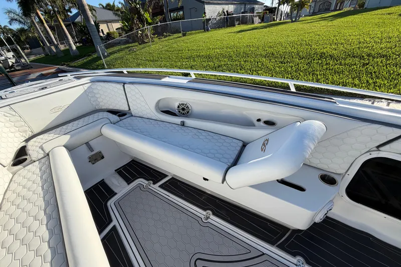 Slide: The Image of 2022 Glasstream 328 Pro-XS boat interior with white seating and hexagonal pattern design. - 26
