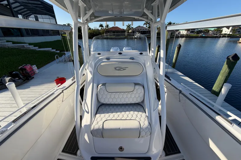 Slide: The Image of 2022 Glasstream 328 Pro-XS boat docked by a serene waterfront. - 28