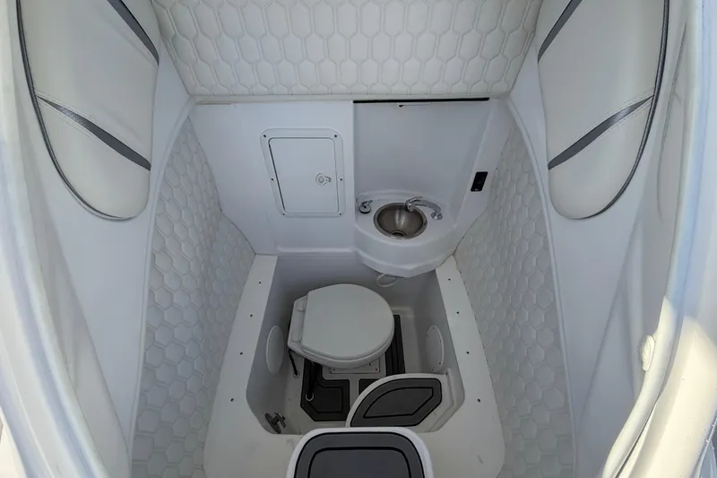 Slide: The Image of 2022 Glasstream 328 Pro-XS boat interior with compact bathroom and sink. - 30