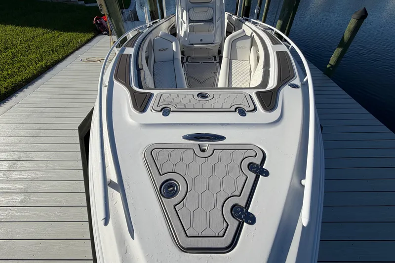Slide: The Image of 2022 Glasstream 328 Pro-XS boat docked, showcasing sleek design and spacious deck. - 31
