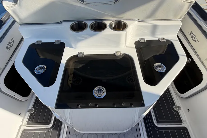 Slide: The Image of 2022 Glasstream 328 Pro-XS boat interior with storage compartments and cup holders. - 40