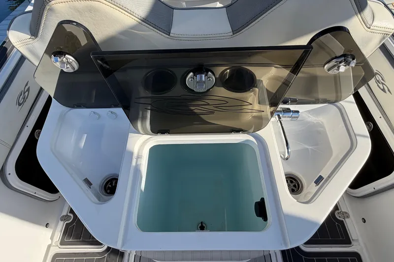 Slide: The Image of 2022 Glasstream 328 Pro-XS boat interior with sink and storage compartments. - 41