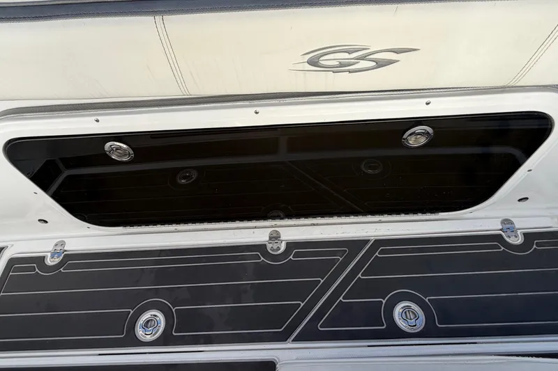 Slide: The Image of 2022 Glasstream 328 Pro-XS boat deck with storage compartment and logo. - 42