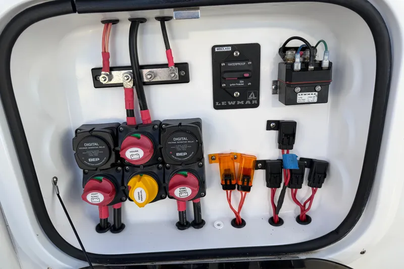 Slide: The Image of Electrical panel of 2022 Glasstream 328 Pro-XS boat with switches and wiring. - 46