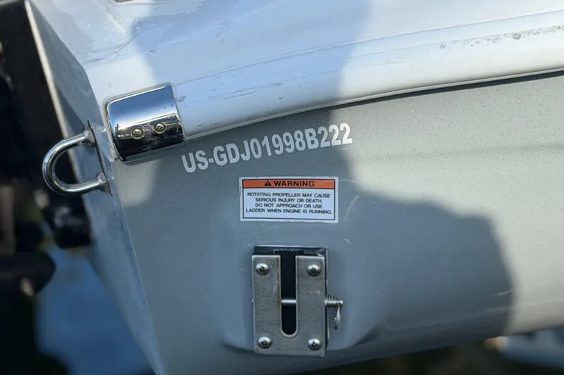 Slide: The Image of 2022 Glasstream 328 Pro-XS boat stern with warning label and identification number. - 49