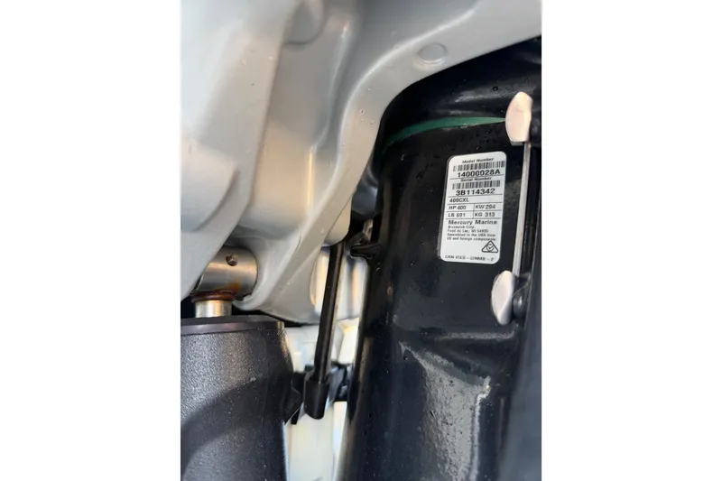 Slide: The Image of Close-up of a 2022 Glasstream 328 Pro-XS engine label, showing specifications and model details. - 51