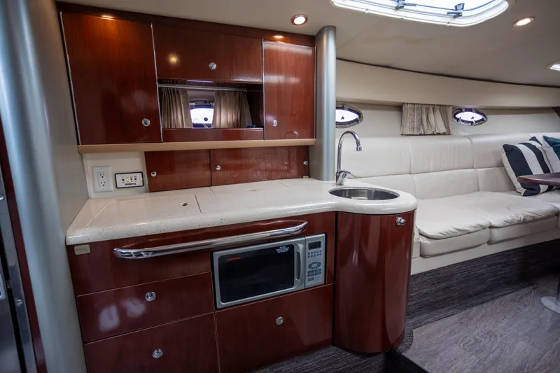 Slide: The Image of Luxurious interior of 2005 Formula 400 Super Sport yacht with kitchenette and seating area. - 14