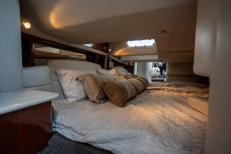 Slide: The Image of Luxurious cabin interior of a 2005 Formula 400 Super Sport yacht with cozy bedding. - 19