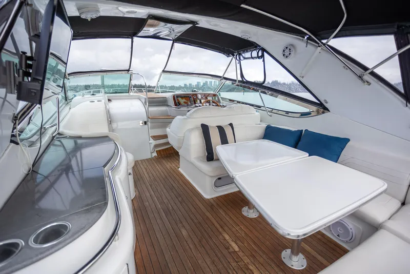 Slide: The Image of Luxurious interior of a 2005 Formula 400 Super Sport yacht with seating and tables. - 2