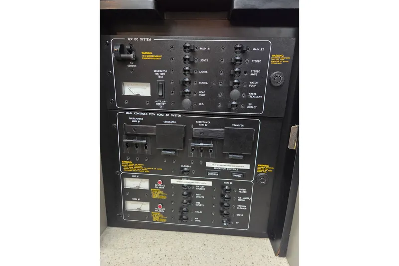 Slide: The Image of Control panel of a 2005 Formula 400 Super Sport boat, featuring various switches and gauges. - 22