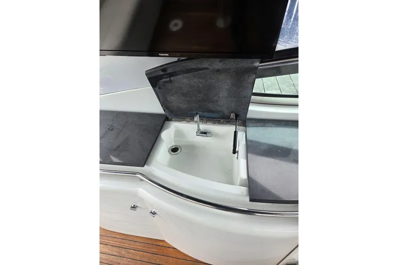 Slide: The Image of 2005 Formula 400 Super Sport yacht sink area with countertop and faucet. - 5