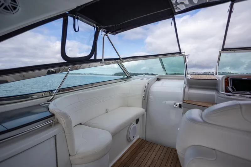 Slide: The Image of Interior of 2005 Formula 400 Super Sport yacht with white seating and wooden flooring. - 6