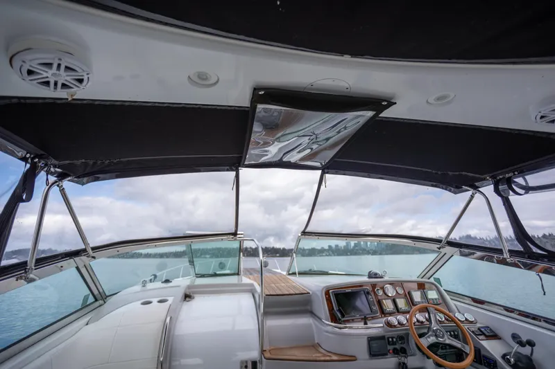 Slide: The Image of Interior view of 2005 Formula 400 Super Sport boat cockpit with steering wheel and controls. - 7