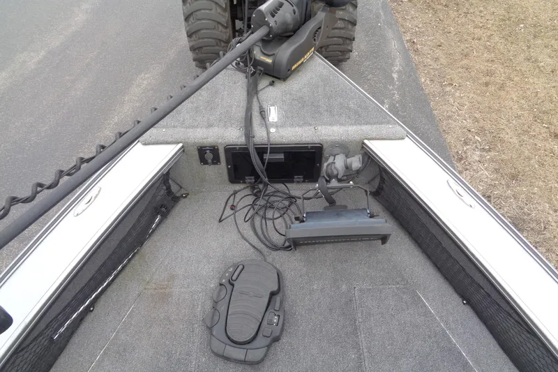 Slide: The Image of 2016 Lund 2175 Pro-V boat deck with trolling motor and control panel. - 14