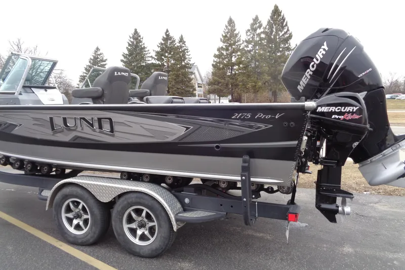 Slide: The Image of 2016 Lund 2175 Pro-V boat with Mercury engine on a trailer. - 2