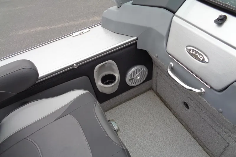 Slide: The Image of 2016 Lund 2175 Pro-V boat interior with seat, speaker, and cup holder. - 20