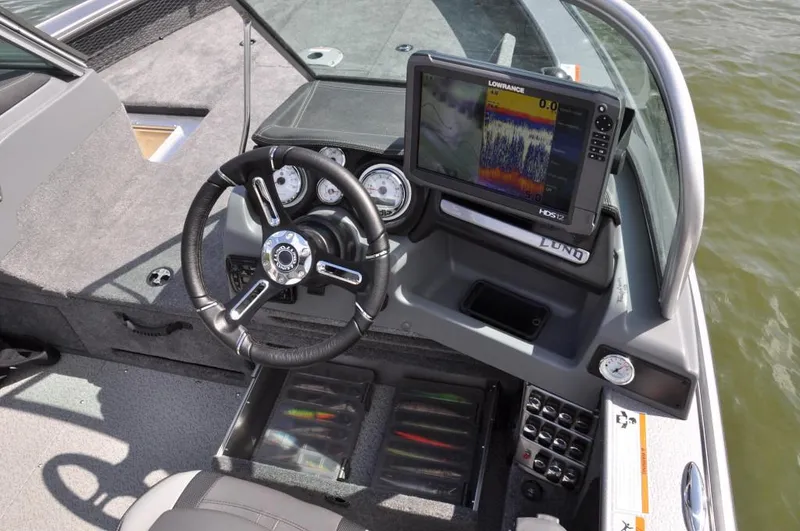 Slide: The Image of Manufacturer Provided Image: 2016 Lund 2175 Pro-V boat dashboard with Lowrance fish finder and steering wheel. - 29