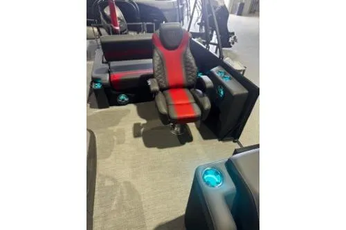 Slide: The Image of 2026 Godfrey Monaco 235 SFLC boat interior with red and black seating and illuminated cup holders. - 4