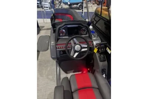 Slide: The Image of 2026 Godfrey Monaco 235 SFLC boat interior with modern dashboard and steering wheel. - 5