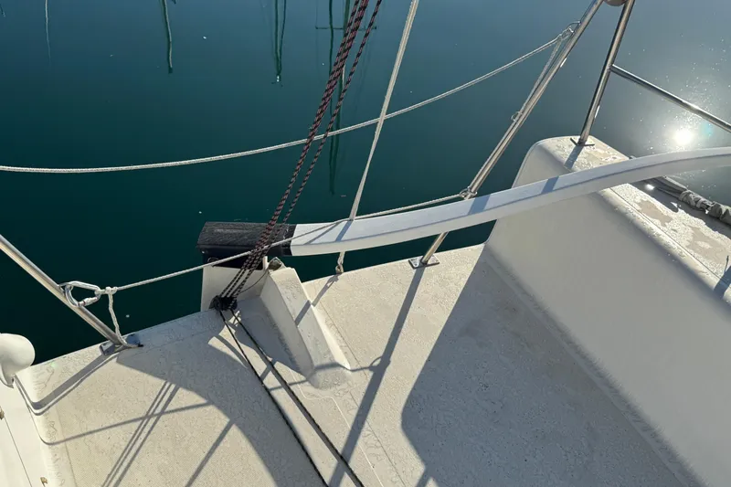 Slide: The Image of Sailboat deck of 2007 Flying Tiger 10M, with ropes and calm water reflection. - 11