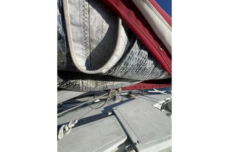 Slide: The Image of Close-up of a 2007 Flying Tiger 10M sailboat's sail and deck details. - 13
