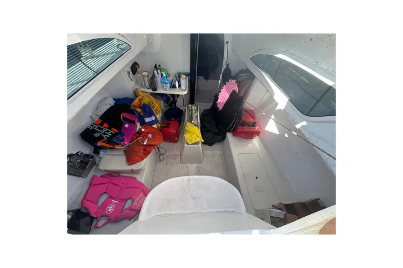 Slide: The Image of Interior of a 2007 Flying Tiger 10M sailboat with various gear and supplies. - 15