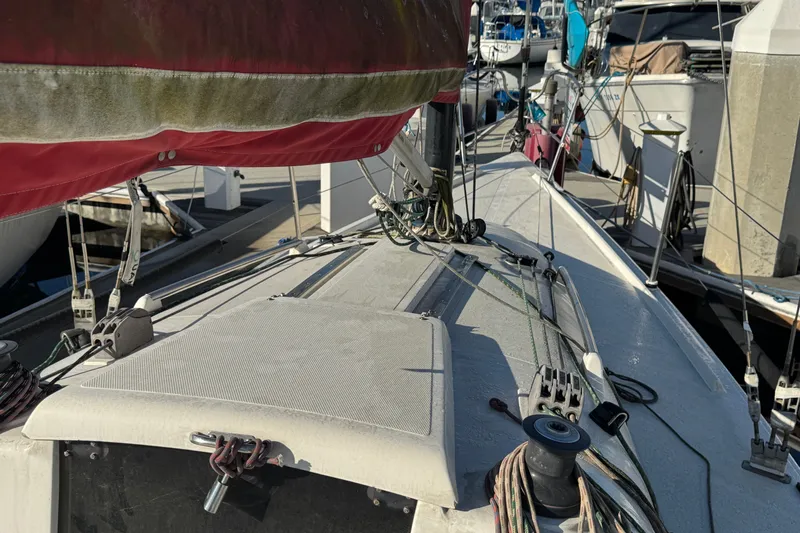 Slide: The Image of Sailboat deck of a 2007 Flying Tiger 10M, docked at a marina. - 16
