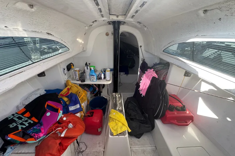 Slide: The Image of Interior of a 2007 Flying Tiger 10M sailboat with gear and supplies. - 17