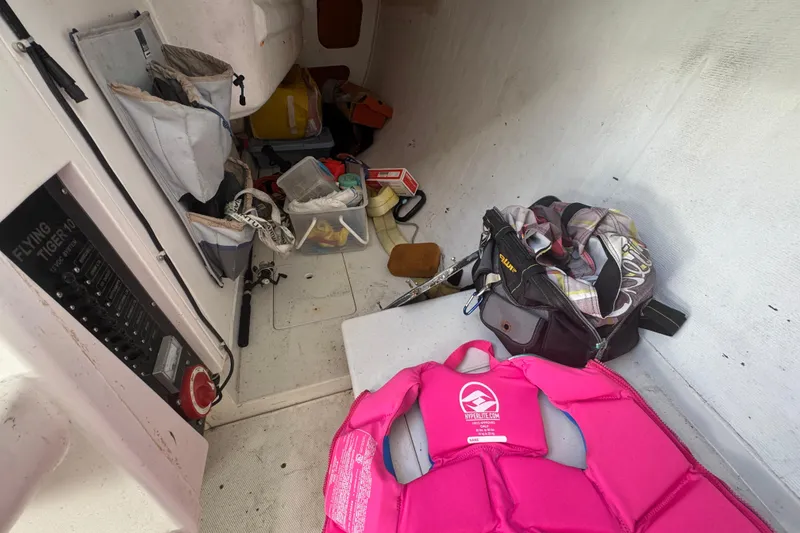 Slide: The Image of Interior of a 2007 Flying Tiger 10M sailboat with gear and equipment. - 19