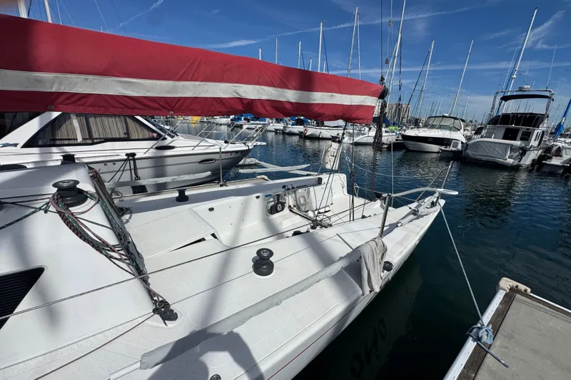 Slide: The Image of Sailboat Flying Tiger 10M, 2007 model, docked in a marina with clear skies. - 2