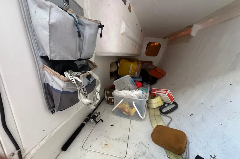 Slide: The Image of Interior of a 2007 Flying Tiger 10M sailboat with storage and equipment. - 21