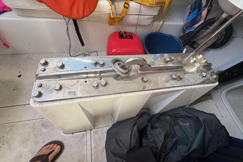 Slide: The Image of Metallic component on a 2007 Flying Tiger 10M sailboat, surrounded by nautical gear. - 24