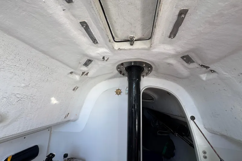 Slide: The Image of Interior view of a 2007 Flying Tiger 10M sailboat cabin ceiling and mast. - 25