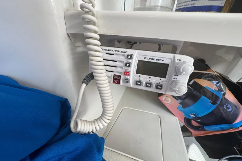 Slide: The Image of VHF radio on a 2007 Flying Tiger 10M sailboat, featuring Standard Horizon Eclipse DSC+. - 26