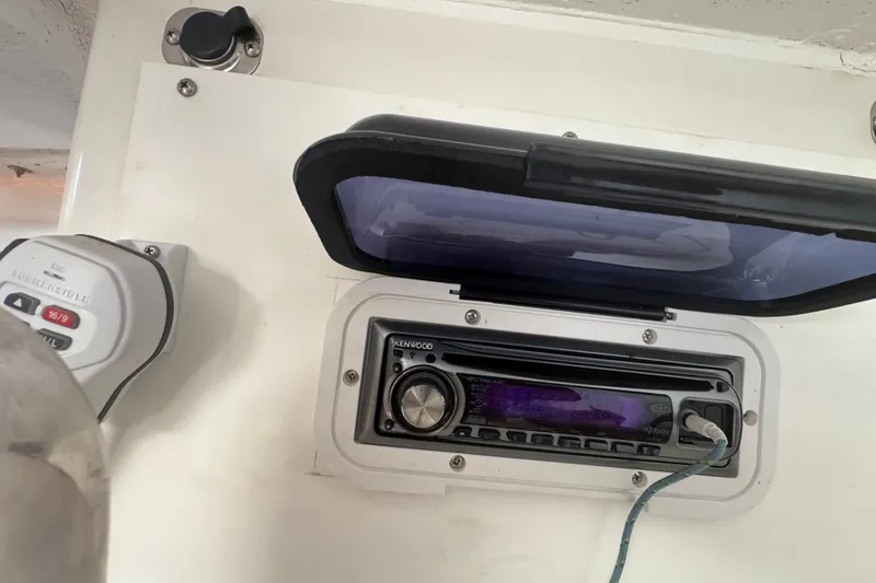 Slide: The Image of Kenwood stereo system in a 2007 Flying Tiger 10M boat cockpit. - 27