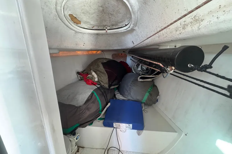 Slide: The Image of Interior of a 2007 Flying Tiger 10M sailboat with sleeping bags and equipment. - 28