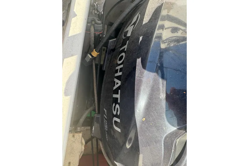 Slide: The Image of Tohatsu engine on a 2007 Flying Tiger 10M sailboat, close-up view. - 32