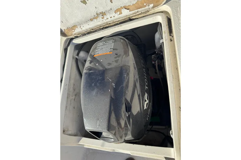 Slide: The Image of Engine compartment of a 2007 Flying Tiger 10M sailboat, featuring a Tohatsu motor. - 33