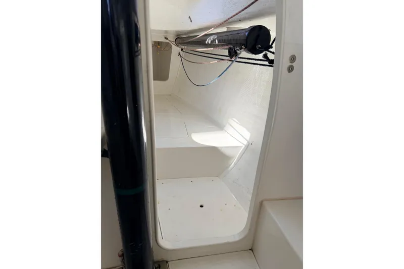 Slide: The Image of Interior view of a 2007 Flying Tiger 10M sailboat, showcasing cabin space and rigging. - 35