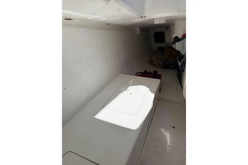 Slide: The Image of Interior cabin of a 2007 Flying Tiger 10M sailboat, featuring storage and equipment. - 37