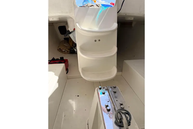 Slide: The Image of Interior of a 2007 Flying Tiger 10M sailboat, featuring storage compartments and sailing gear. - 39