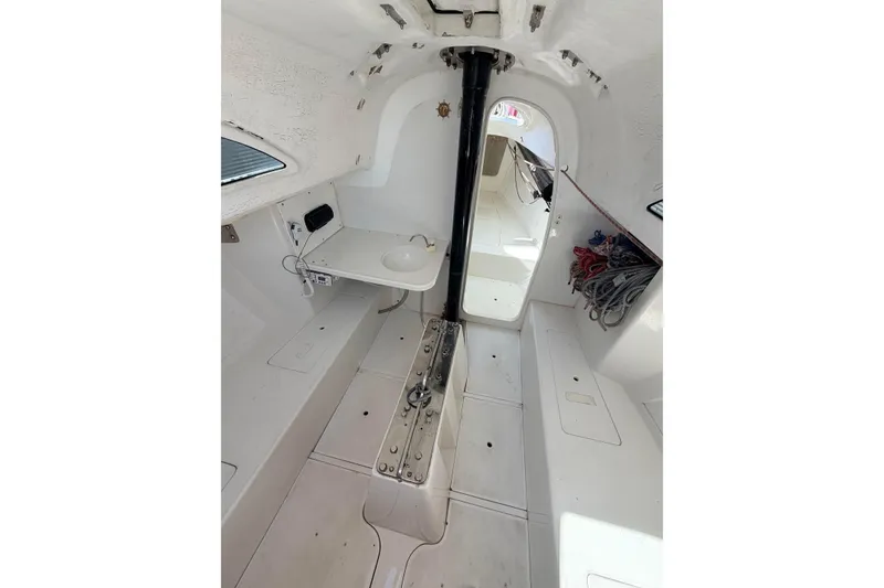 Slide: The Image of Interior of a 2007 Flying Tiger 10M sailboat, featuring a compact cabin layout. - 40