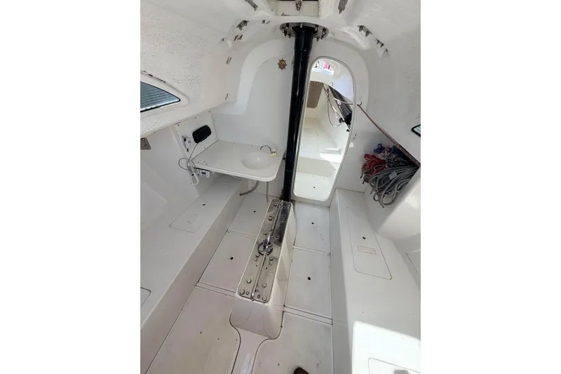 Slide: The Image of Interior of a 2007 Flying Tiger 10M sailboat, featuring a compact cabin layout. - 41